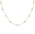 A delicate gold chain necklace featuring small, evenly spaced light blue beads on a plain white background.