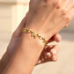 Gold butterfly bracelet on wrist dainty adjustable waterproof jewelry
