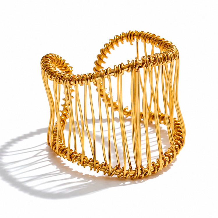 Front view of the Hali Wire Ring, a waterproof non-tarnish gold woven statement ring on a white background