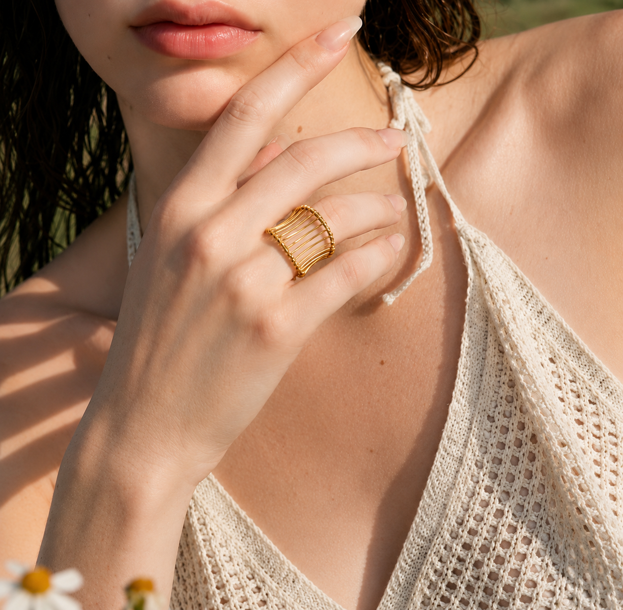 Model wearing the Hali Wire Ring featuring a modern woven gold design and adjustable fit
