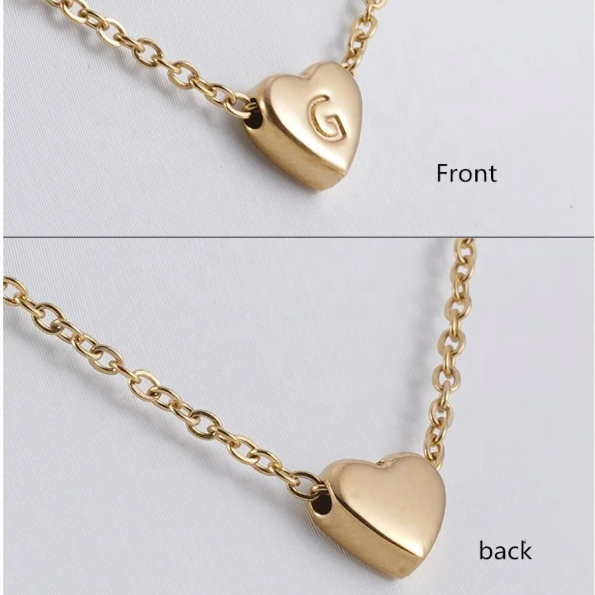 Close-up of the Heart Initial Necklace showing the engraved initial on the front and polished back. Waterproof jewelry by XMTX Collections