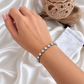 Jane silver rhinestone bracelet worn on wrist