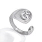 Silver Jennie Ring with polished sculptural band and round crystal stone on white background.