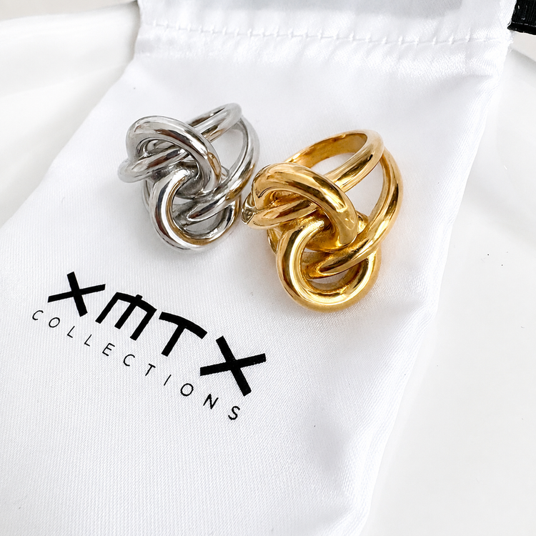 Knotted statement ring shown in gold and silver finishes