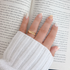Lauren gold stacked ring worn on hand, everyday waterproof jewelry styled with cozy aesthetic