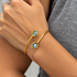London Blue bangle bracelet worn on wrist