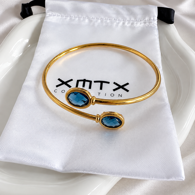 London Blue bangle bracelet with XMTX Collections pouch