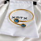 London Blue bangle bracelet with XMTX Collections pouch