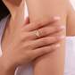 Gold marquise clear stone ring on middle finger worn by model, minimal waterproof statement ring