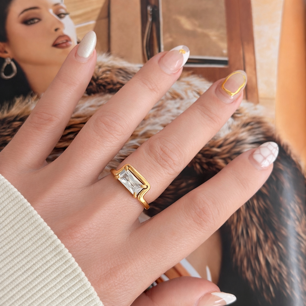 Macy gold baguette ring worn on hand aesthetic lifestyle shot