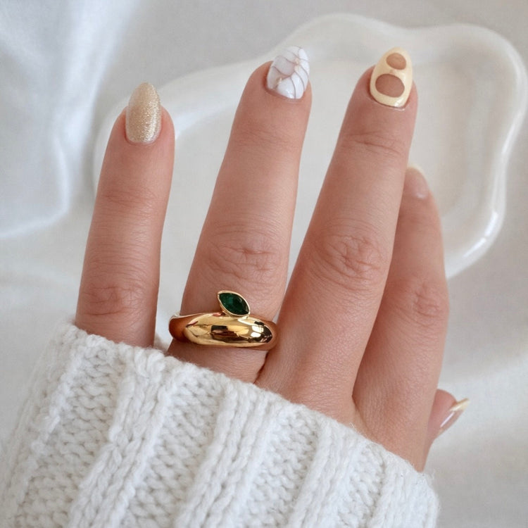 Natalie Ring gold dome band with emerald green marquise stone worn on hand