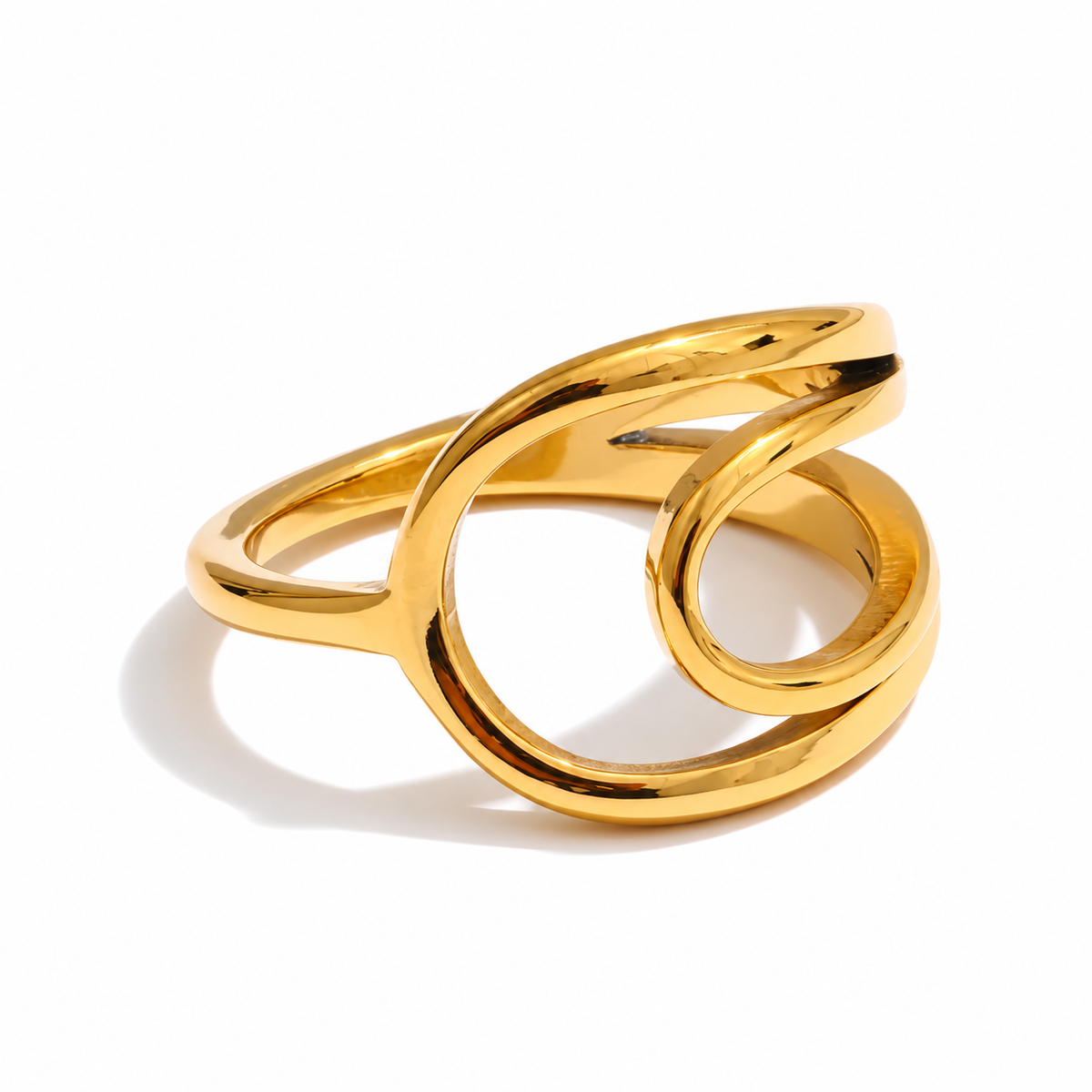 Nico Sculptural Ring in polished gold with an open design and flowing curved bands.