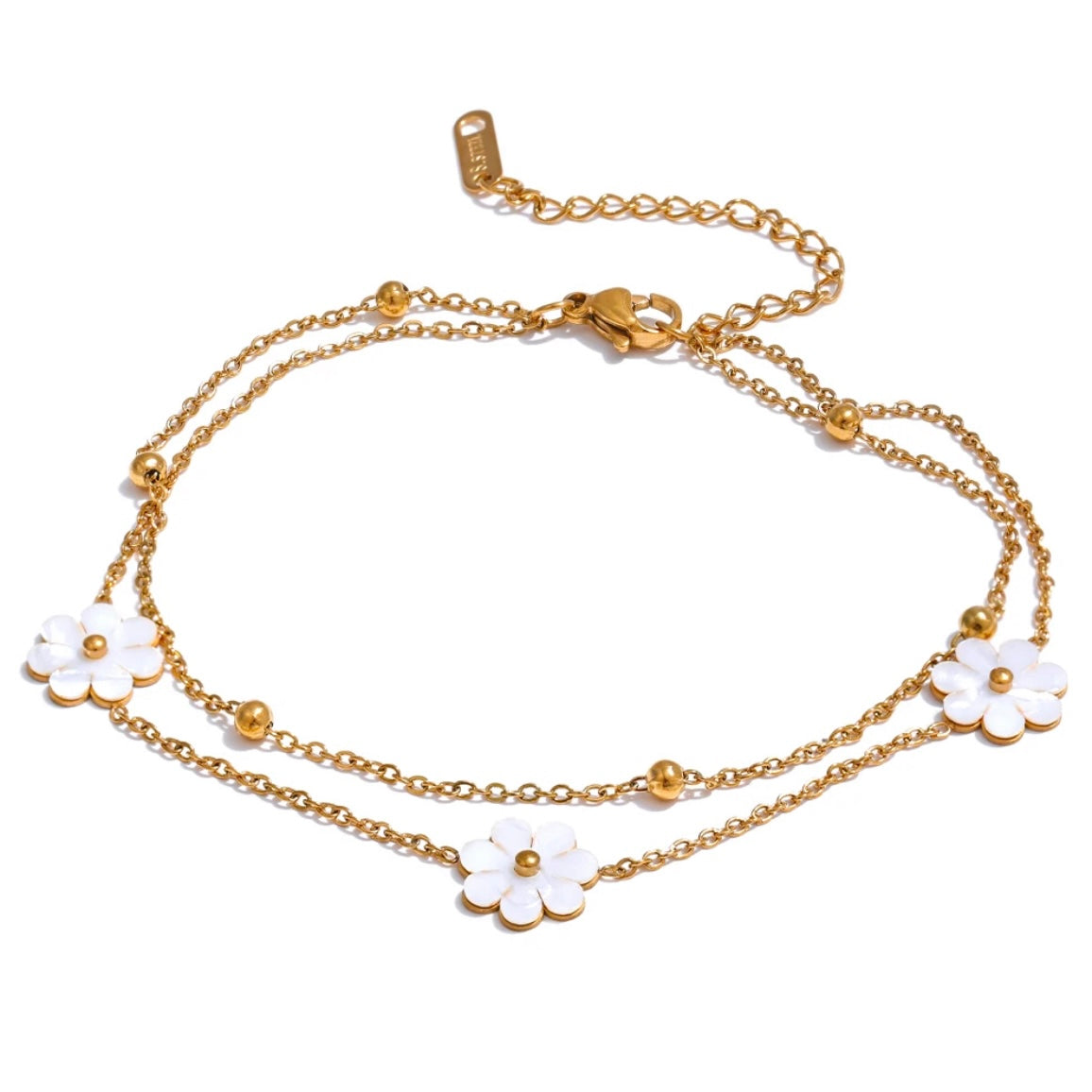 Add a touch of whimsy to your outfit with our Mother of Pearl Flowers Anklet. Delicate and dainty, this anklet features pretty, natural shell flowers that will elevate any look. Perfect for those who want to add a fun and playful touch to their style.

&nbsp;

This piece is made to last, hypoallergenic anti tarnish &amp; water resistant&nbsp;

316L Stainless Steel 18K Gold Plated

8.5 inches long +2 inches ext