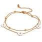Add a touch of whimsy to your outfit with our Mother of Pearl Flowers Anklet. Delicate and dainty, this anklet features pretty, natural shell flowers that will elevate any look. Perfect for those who want to add a fun and playful touch to their style.

&nbsp;

This piece is made to last, hypoallergenic anti tarnish &amp; water resistant&nbsp;

316L Stainless Steel 18K Gold Plated

8.5 inches long +2 inches ext