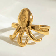 Experience beach life all year round with our Octopus Open Ring. This charming accessory is perfect for those who love forever summer vibes. Its cute design will add a touch of whimsy to any outfit. Get your hands on this must-have piece now.

Metal: 18K Gold over Stainless Steel&nbsp;

Size: Adjustable fits size 7/8