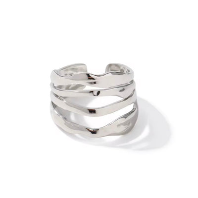 Experience timeless elegance with our Four Layers Ring. Crafted with precision and beauty in mind, this ring is sure to make a statement. The unique four layers design adds a modern touch to its classic beauty. Perfect for any occasion, this ring is a must-have for any jewelry collection.

Metal:&nbsp; Stainless Steel&nbsp;

Water resistant, Beach Friendly

Size: Adjustable fits size 7/8