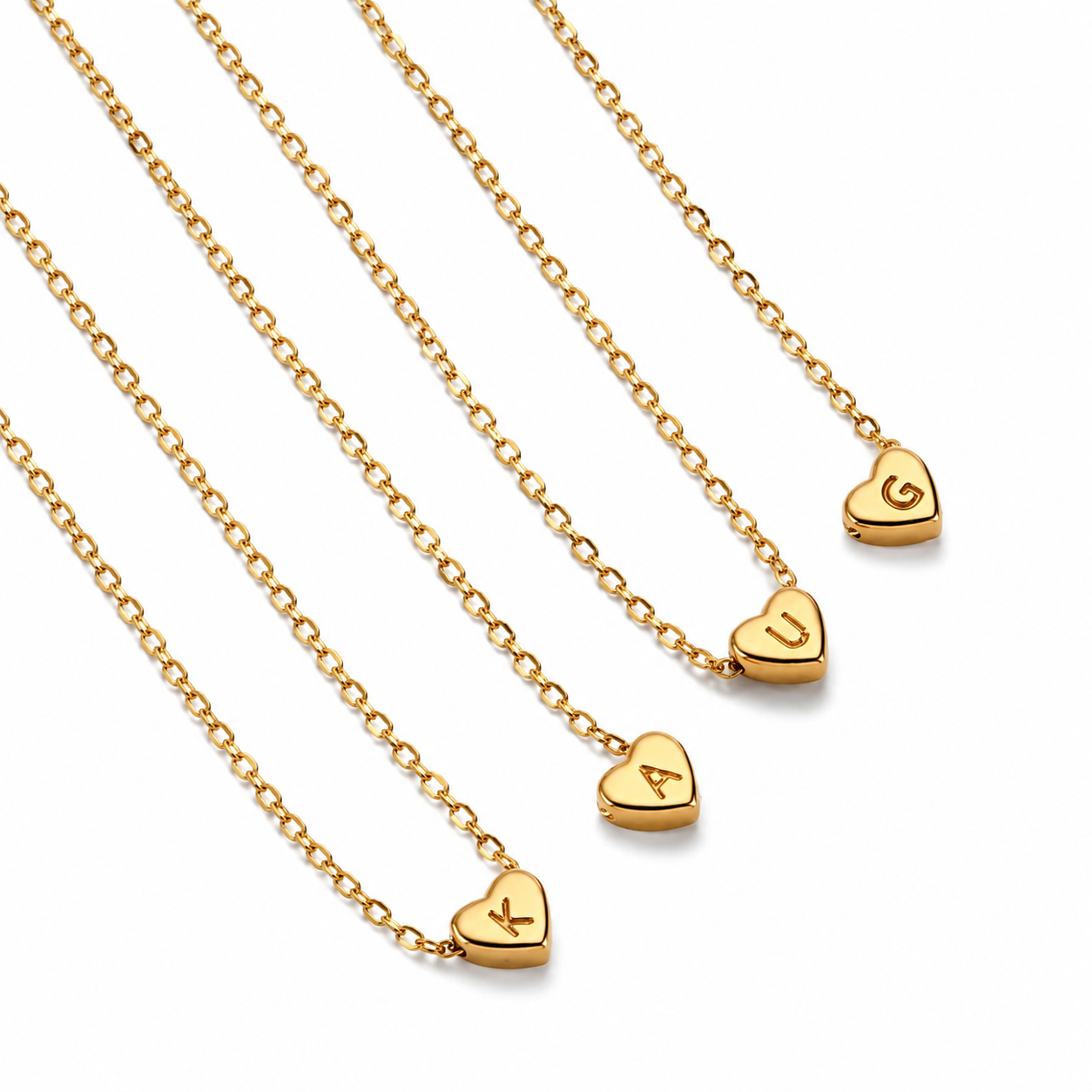 Gold Heart Initial Necklaces with engraved letters. Waterproof, hypoallergenic, non-tarnish personalized jewelry by XMTX Collections