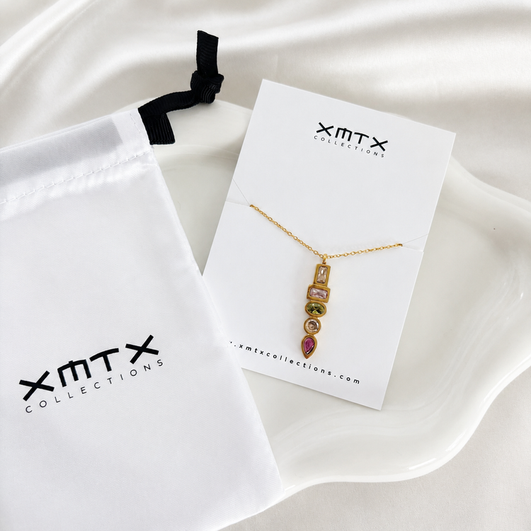 Waterproof non tarnish gold pendant necklace featuring five colorful bezel-set cubic zirconia stones.