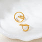 Close-up of Pyper waterproof gold earrings on ear
