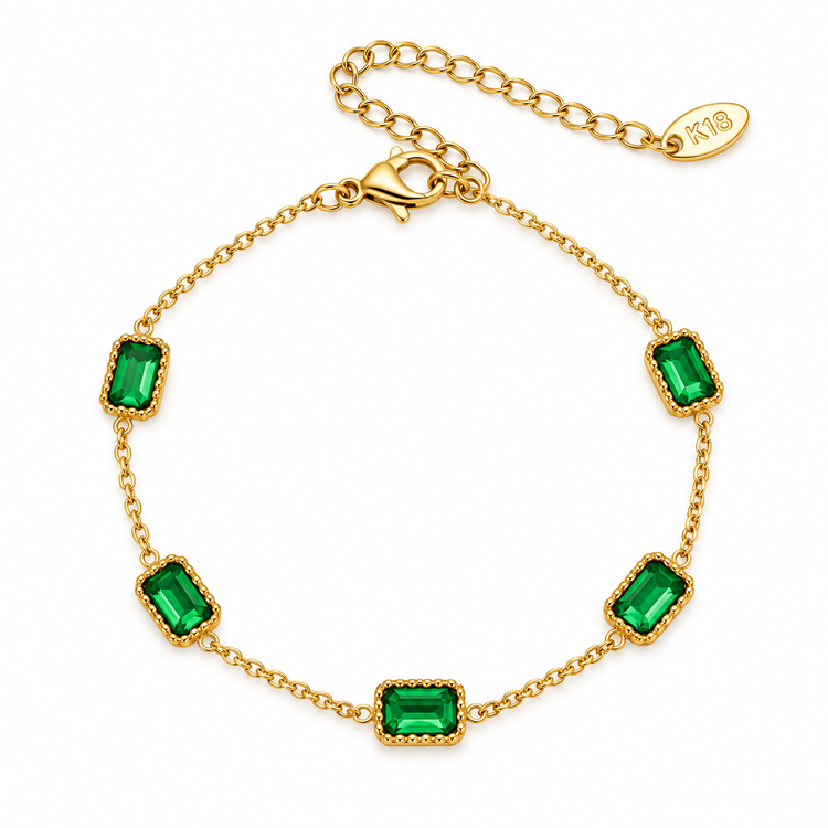 Reese Bracelet with emerald green stones and gold detailing
