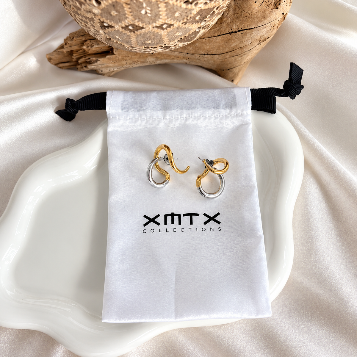 Rhea Lux earrings with XMTX Collections pouch