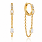 Waterproof gold huggie earrings with cubic zirconia, chain tassels, and clear pear-cut stones