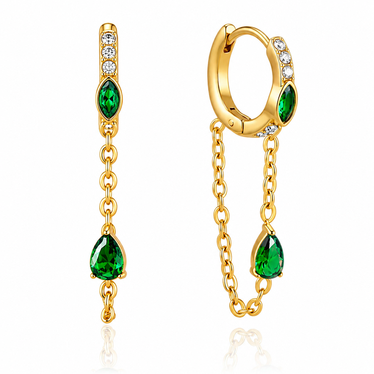 Waterproof gold huggie earrings with emerald green stones, cubic zirconia accents, and chain tassels.