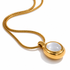 Close-up of Selena mother of pearl necklace with polished gold pendant and snake chain