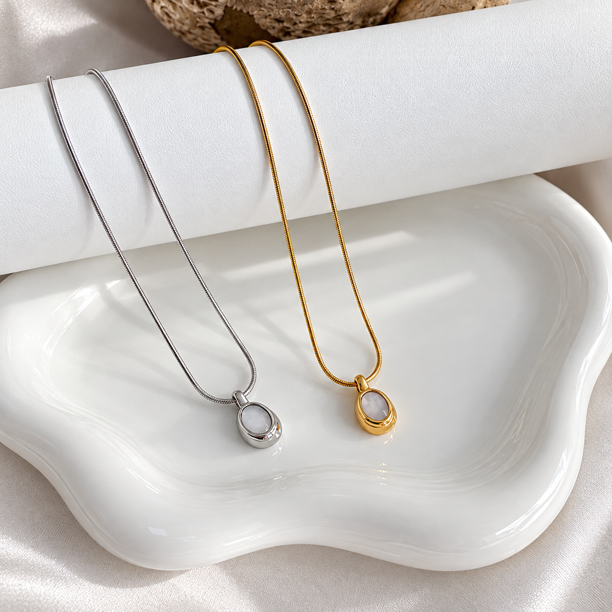 Selena mother of pearl necklace shown in gold and silver finishes with natural stone pendant