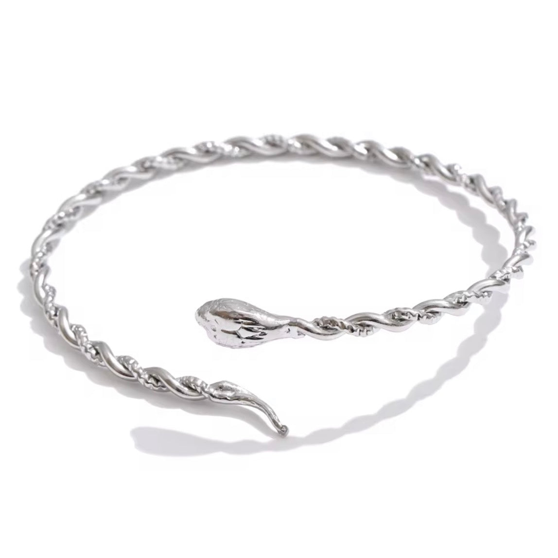 Silver snake bangle bracelet made from polished stainless steel with an open cuff design