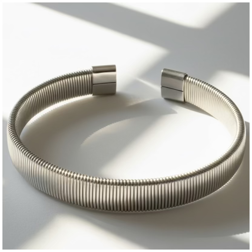 Silver bracelet on a shadowy surface