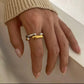 The Angelika Open Band Ring is a stunning embodiment of modern elegance and sophistication. With a seamless blend of gold and silver tones, this ring exudes luxury and versatility. Made with a durable and comfortable design, it is the perfect statement piece for any occasion.

Metal:&nbsp; Stainless Steel

Hypoallergenic &amp; Water Resistant

Size: 7 only