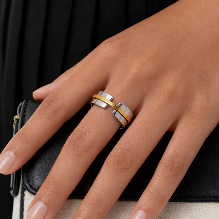 Stacy two tone ring on model hand, modern waterproof jewelry styled with black outfit