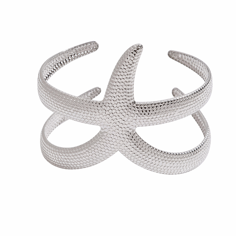 Silver starfish bangle bracelet on white background waterproof stainless steel