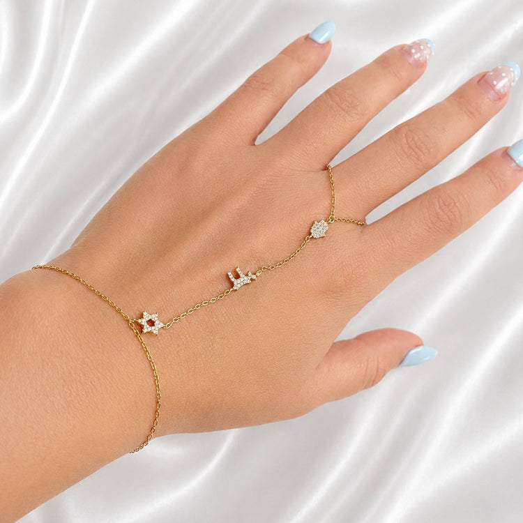 Woman wearing Sterling Silver Star of David Hamsa and Chai Hand Chain Bracelet
