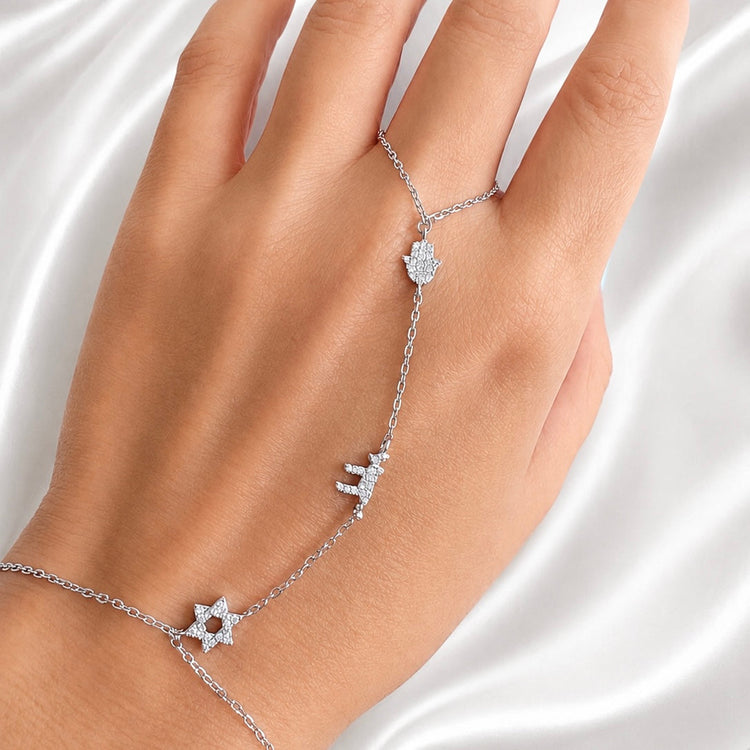 Woman wearing Sterling Silver Star of David Hamsa and Chai Hand Chain Bracelet in silver
