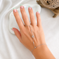 Model wearing a sterling silver Star of David hand chain featuring sparkling bezel-set stones and an adjustable bracelet for everyday wear.