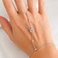 Sterling silver Star of David hand chain with bezel-set cubic zirconia accents shown in silver