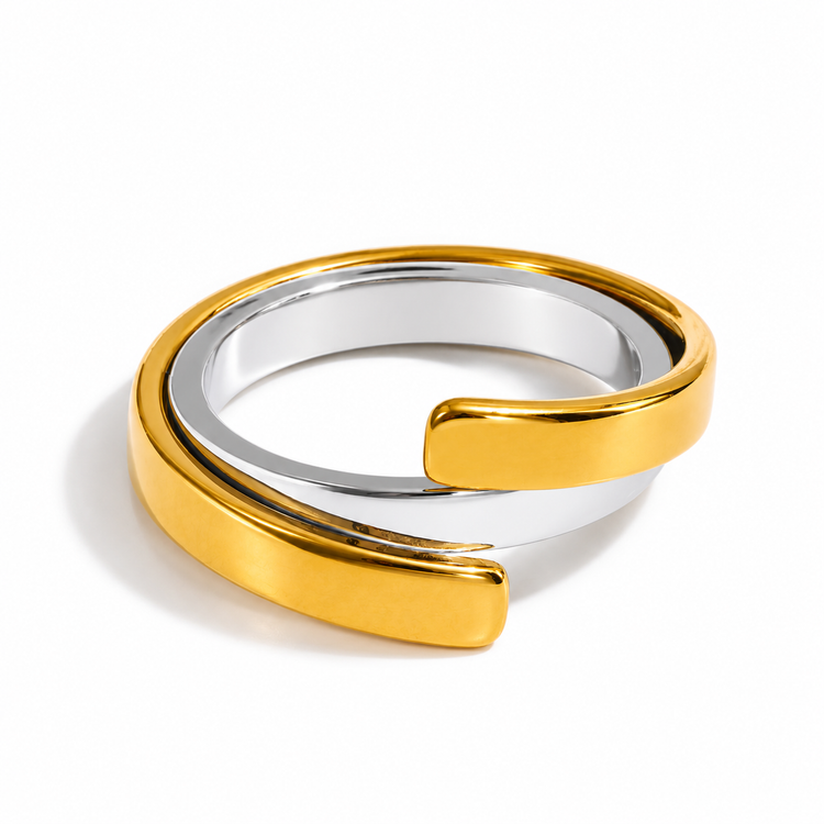Stevie Two Tone Ring featuring overlapping polished gold and silver curved bands