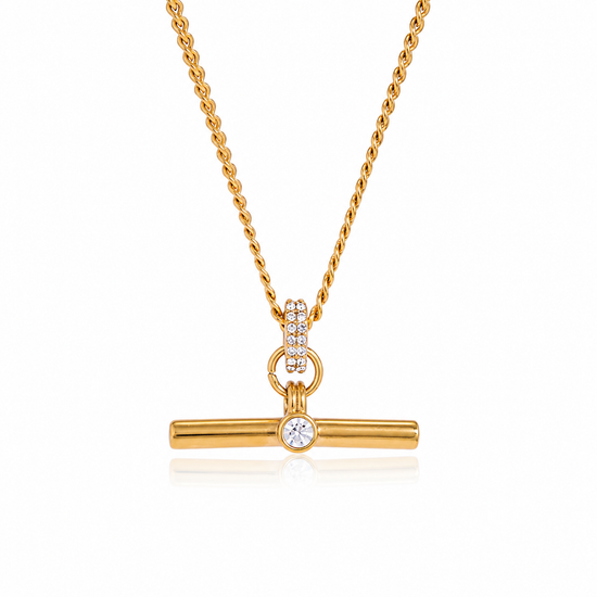 T Bar necklace in 18K gold PVD plated stainless steel featuring a crystal accent on a white background. Waterproof, non-tarnish, hypoallergenic everyday necklace by XMTX Collections.