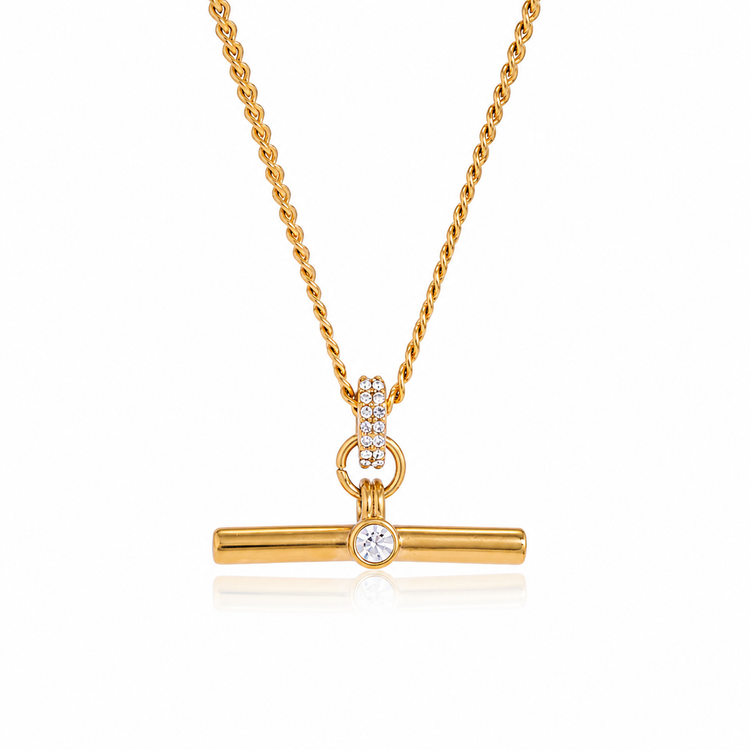 T Bar necklace in 18K gold PVD plated stainless steel featuring a crystal accent on a white background. Waterproof, non-tarnish, hypoallergenic everyday necklace by XMTX Collections.