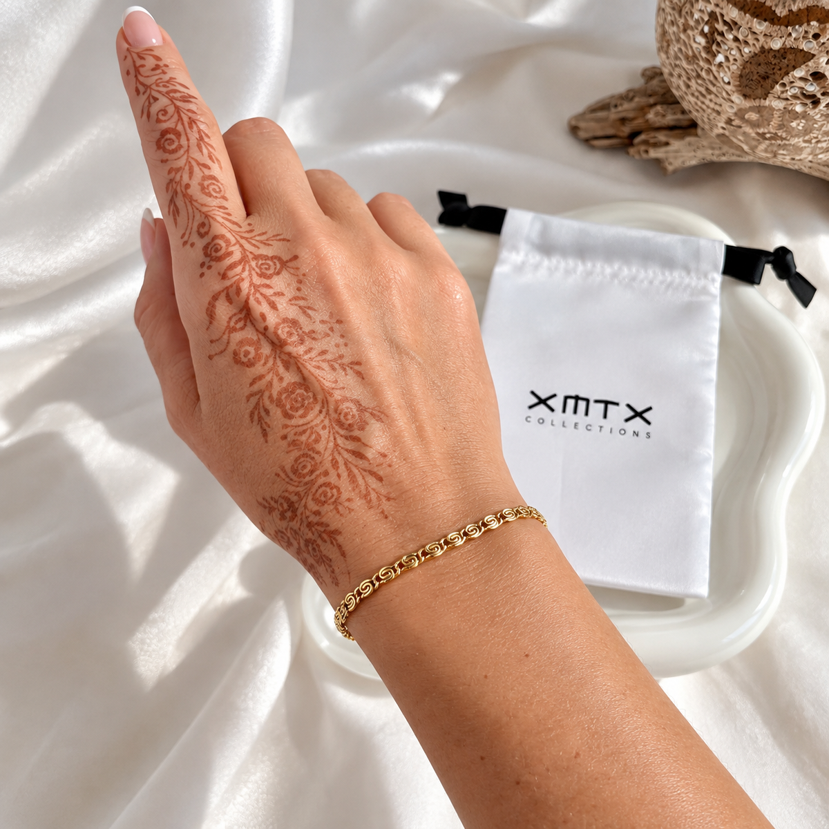Thea dainty gold bracelet worn on wrist