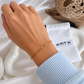 Tillie Dainty Bracelet worn on the wrist, featuring a delicate gold mixed-link design
