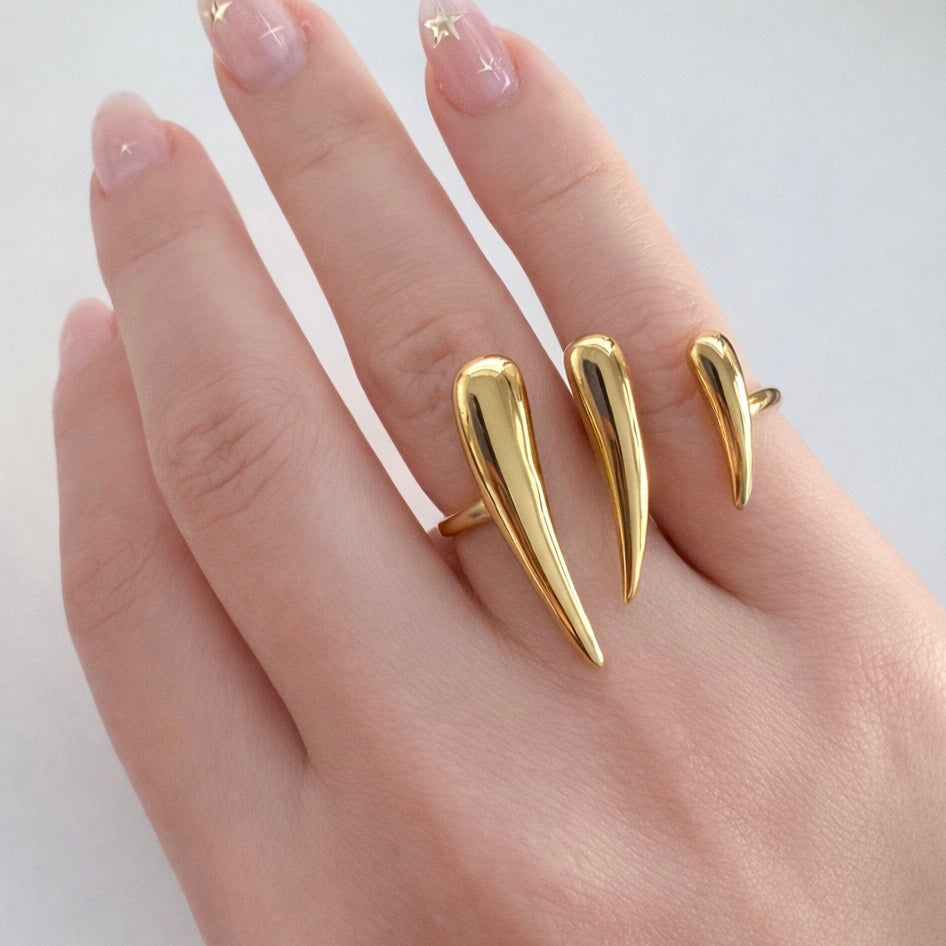 Gold Vesper dual spike ring worn on hand, stainless steel statement ring by XMTX Collections