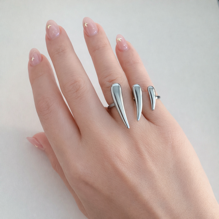 Silver Vesper dual spike ring worn on hand, stainless steel statement ring by XMTX Collections