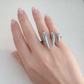Silver Vesper dual spike ring worn on hand, stainless steel statement ring by XMTX Collections