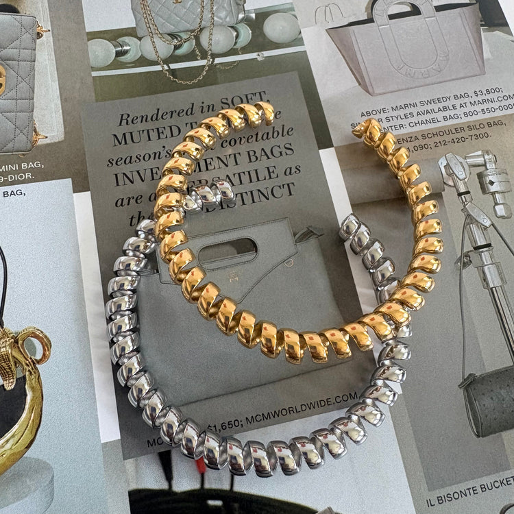 Gold and silver Vintage Phone Cord Bangle Bracelets styled on a fashion magazine flat lay