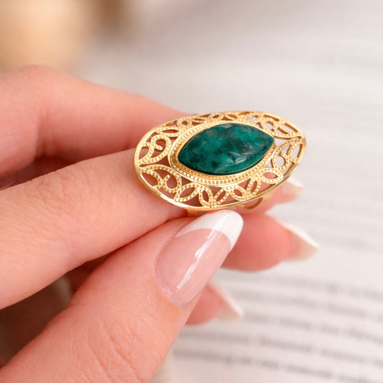 Close-up of green African turquoise stone in gold setting