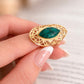 Close-up of green African turquoise stone in gold setting