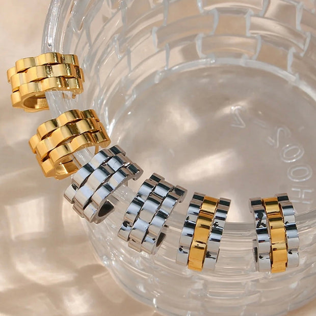 

Introducing our Watchband Hoop Earrings - a unique design that will elevate any look. Its small size ensures it will stand out and add a touch of sophistication to your outfit. With these earrings, you'll be making a stylish statement that is both elegant and exclusive.

Made to last!&nbsp;Tarnish and Water Resistant, Hypoallergenic

.6" diameter